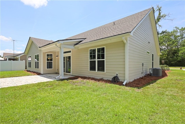 138 Clearwater Dr, Brunswick, GA 31523 - back of house with roof with shingles, central AC, and a patio