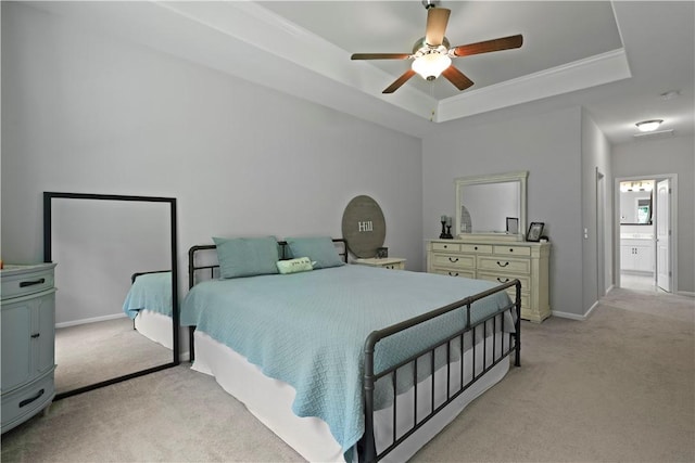138 Clearwater Dr, Brunswick, GA 31523 - bedroom featuring light carpet, a raised ceiling, baseboards, and a ceiling fan