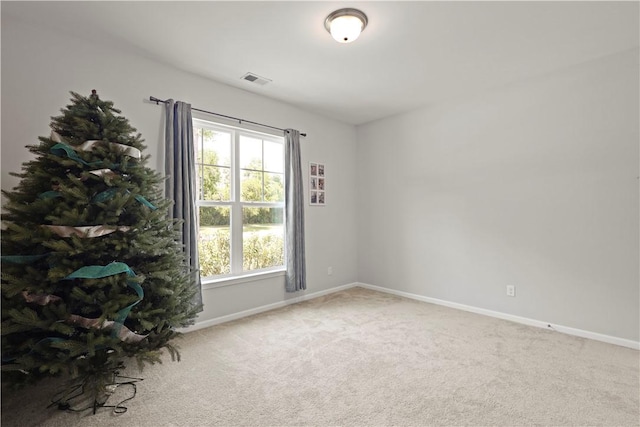 138 Clearwater Dr, Brunswick, GA 31523 - empty room featuring plenty of natural light, carpet flooring, and baseboards