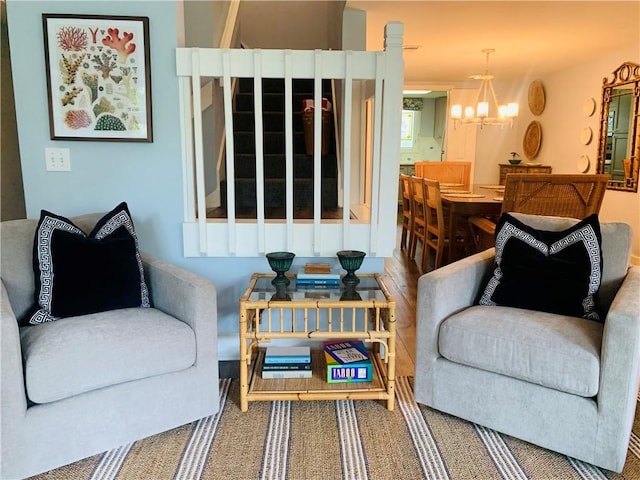 living area with a notable chandelier