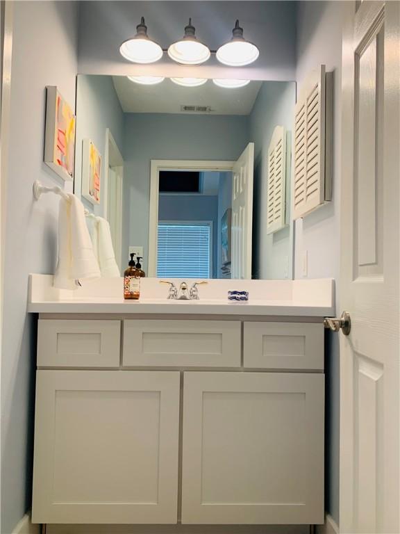 bathroom featuring visible vents and vanity