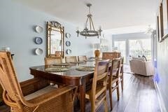 dining space with a notable chandelier and wood finished floors