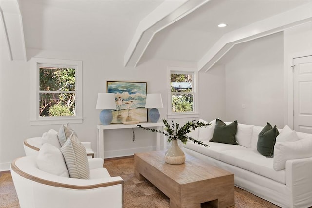 living room with vaulted ceiling with beams