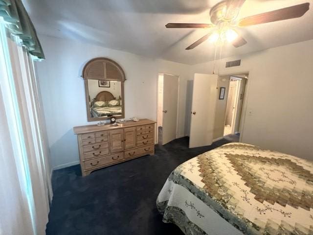 carpeted bedroom featuring ceiling fan