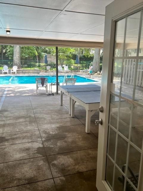 view of swimming pool featuring a patio area