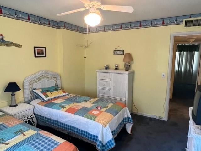 carpeted bedroom featuring ceiling fan