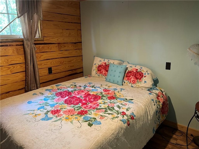 bedroom with dark wood-type flooring