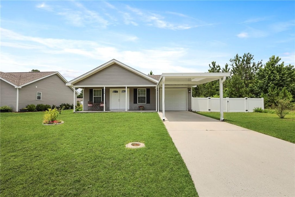 179 Winstead Dr, Brunswick, GA 31525 - view of front of property featuring a garage, a porch, and driveway