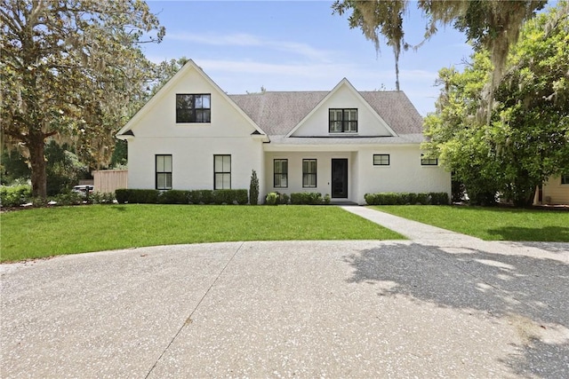 4 Lake View Cottages Ct, Saint Simons Island, GA 31522 - modern farmhouse style home with a front lawn and stucco siding