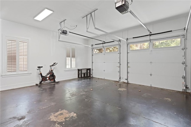 4 Lake View Cottages Ct, Saint Simons Island, GA 31522 - garage with a garage door opener and baseboards
