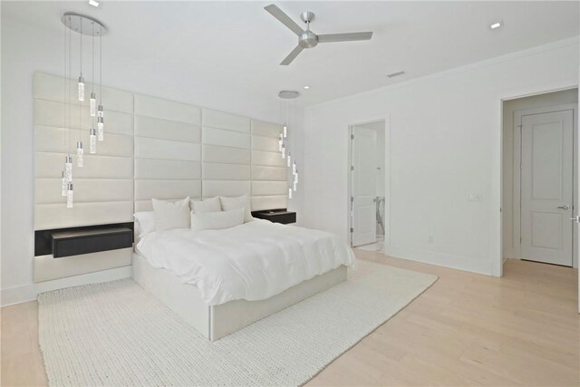 4 Lake View Cottages Ct, Saint Simons Island, GA 31522 - bedroom featuring ornamental molding, wood finished floors, baseboards, and a ceiling fan