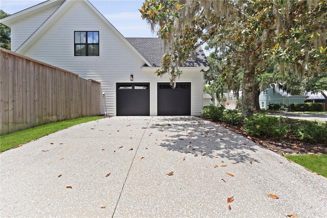 4 Lake View Cottages Ct, Saint Simons Island, GA 31522 - view of front of property with driveway and a shingled roof