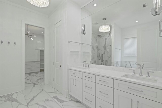 4 Lake View Cottages Ct, Saint Simons Island, GA 31522 - bathroom with marble look tiles, a chandelier, a marble finish shower, recessed lighting, and double vanity