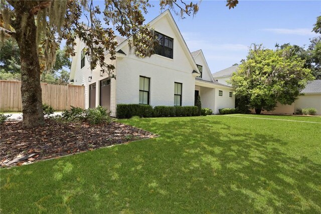 4 Lake View Cottages Ct, Saint Simons Island, GA 31522 - view of front of home featuring stucco siding and a garage