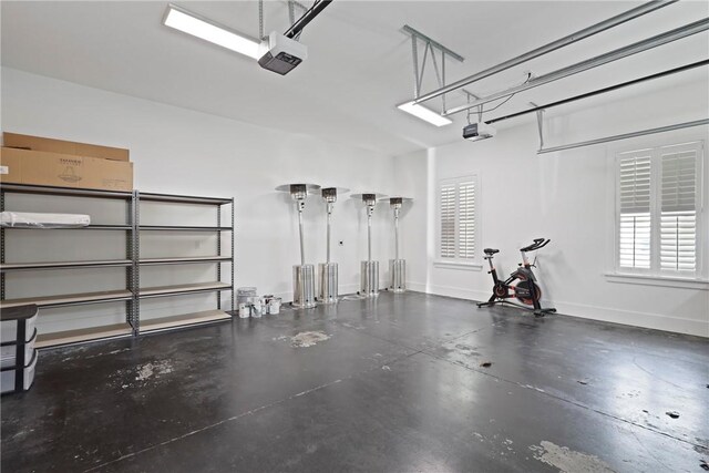 4 Lake View Cottages Ct, Saint Simons Island, GA 31522 - garage featuring a garage door opener and baseboards