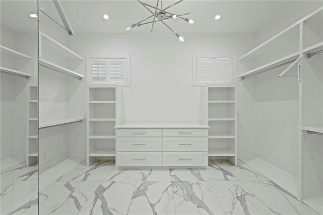 4 Lake View Cottages Ct, Saint Simons Island, GA 31522 - spacious closet featuring a chandelier and light marble finish floors