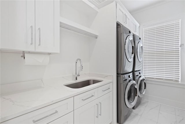 4 Lake View Cottages Ct, Saint Simons Island, GA 31522 - washroom with stacked washer / dryer, light marble finish floors, and cabinet space