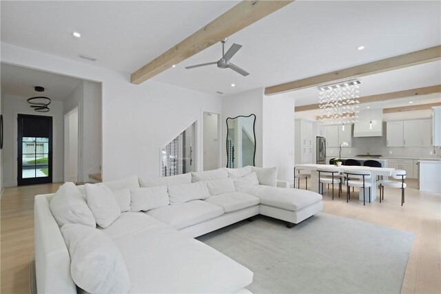 4 Lake View Cottages Ct, Saint Simons Island, GA 31522 - living area featuring beamed ceiling, light wood-style flooring, ceiling fan, recessed lighting, and a chandelier