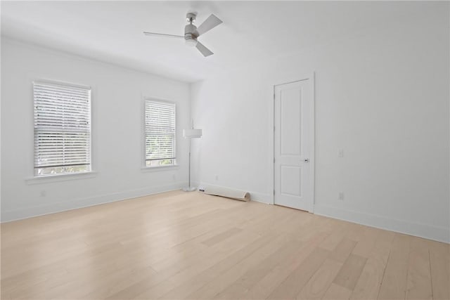 4 Lake View Cottages Ct, Saint Simons Island, GA 31522 - spare room featuring light wood-style floors, ceiling fan, and baseboards