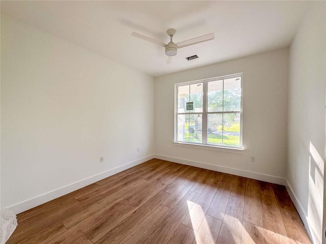 1047 Tranquility Pl NE, Townsend, GA 31331 - empty room featuring baseboards, hardwood / wood-style flooring, and ceiling fan