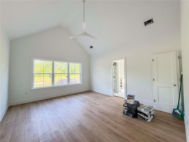 1047 Tranquility Pl NE, Townsend, GA 31331 - unfurnished living room with a ceiling fan, baseboards, wood finished floors, and high vaulted ceiling
