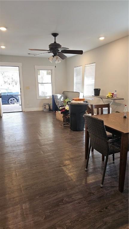 dining space with dark hardwood / wood-style floors and ceiling fan