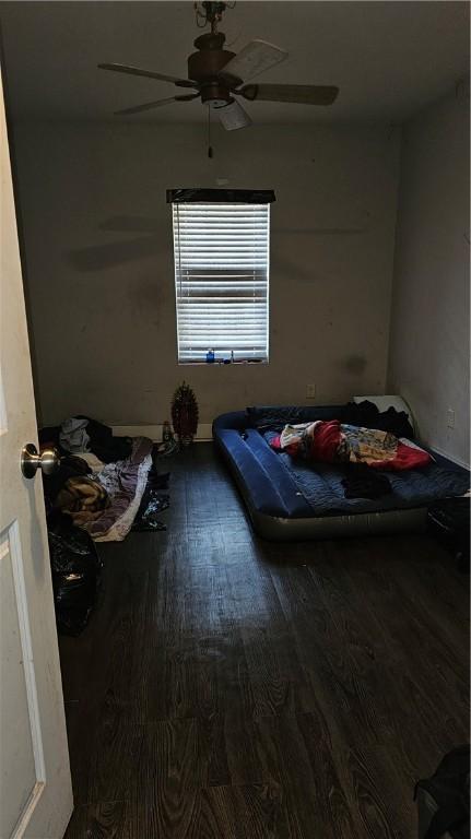 bedroom featuring ceiling fan and wood-type flooring