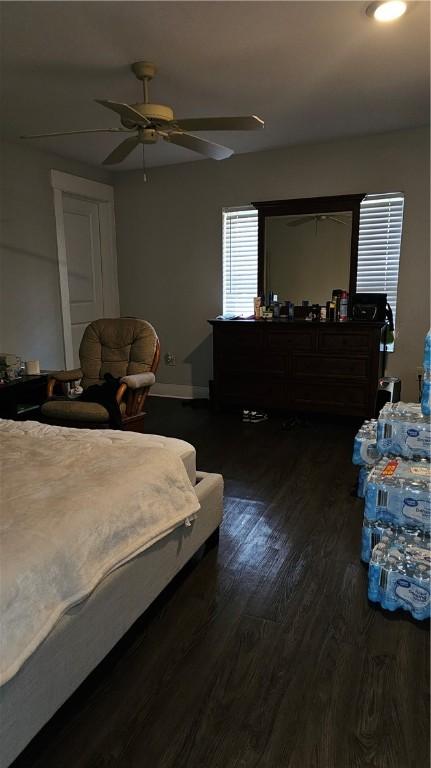 bedroom featuring ceiling fan and dark hardwood / wood-style floors