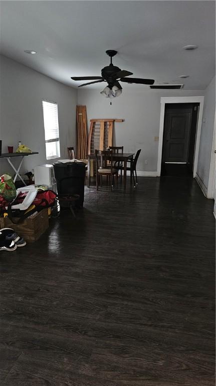 dining area with dark hardwood / wood-style floors and ceiling fan