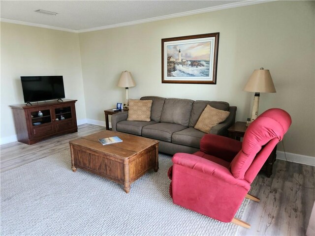 1175 N Beachview Dr Unit 286, Jekyll Island, GA 31527 - living room with crown molding and light hardwood / wood-style floors