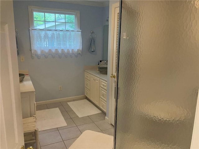 7 Hyde Ave, Jekyll Island, GA 31527 - bathroom with a stall shower, vanity, tile patterned floors, and baseboards