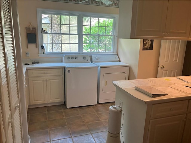 7 Hyde Ave, Jekyll Island, GA 31527 - washroom featuring washer and dryer, tile patterned floors, and cabinet space