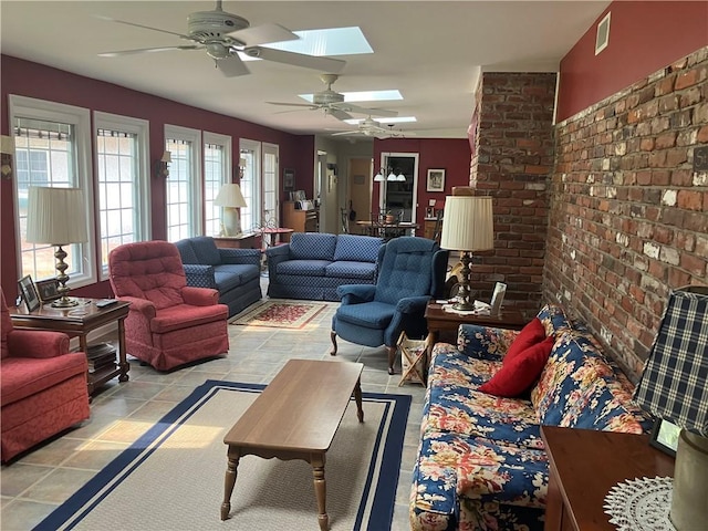 7 Hyde Ave, Jekyll Island, GA 31527 - living room featuring a ceiling fan and a skylight