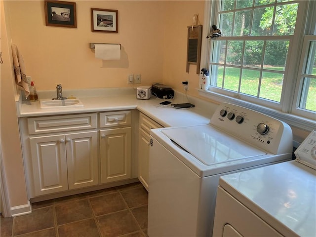 7 Hyde Ave, Jekyll Island, GA 31527 - washroom with a sink, washer and clothes dryer, and dark tile patterned flooring