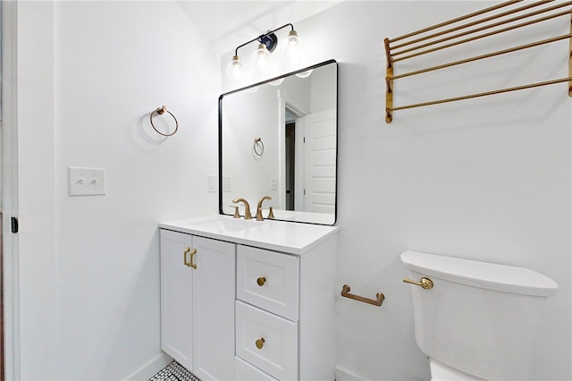 bathroom with toilet and vanity