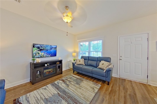 288 Bridgewater Ln, Darien, GA 31305 - living area with wood finished floors and ceiling fan