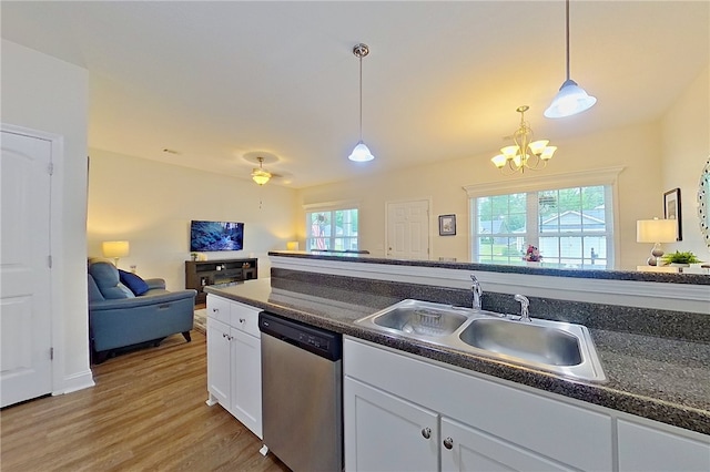 288 Bridgewater Ln, Darien, GA 31305 - kitchen with dishwasher, dark countertops, white cabinets, light wood-type flooring, and a chandelier