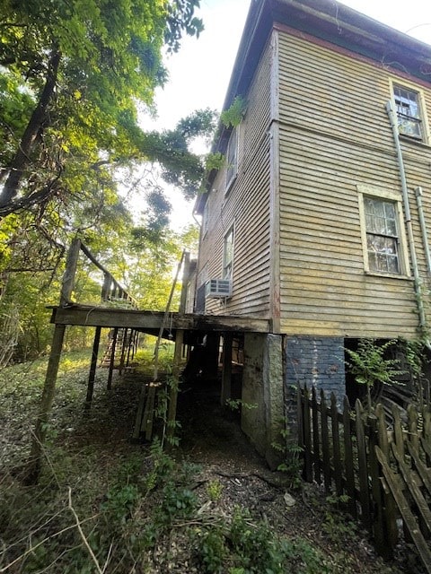 view of property exterior featuring fence