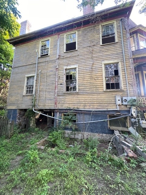 view of home's exterior featuring a chimney