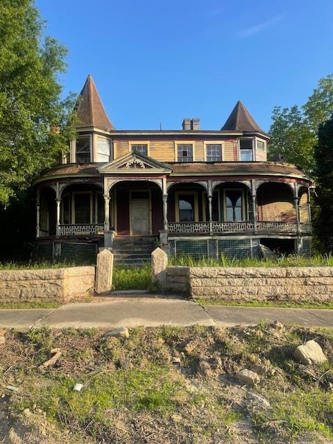 victorian-style house with a porch