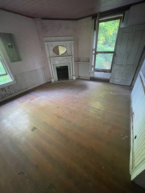 unfurnished living room with a fireplace and wood-type flooring