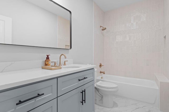 full bathroom with vanity, toilet, and washtub / shower combination