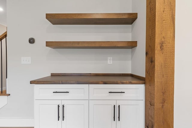 bar featuring white cabinetry