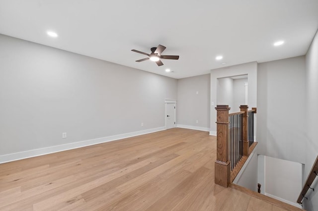 interior space featuring light wood-type flooring and ceiling fan