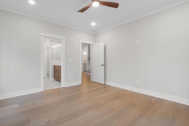 unfurnished bedroom with connected bathroom, ceiling fan, and light hardwood / wood-style flooring