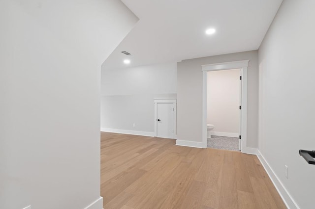 spare room with light hardwood / wood-style floors