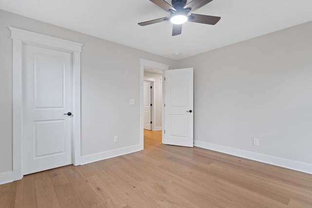 unfurnished bedroom with ceiling fan and light wood-type flooring