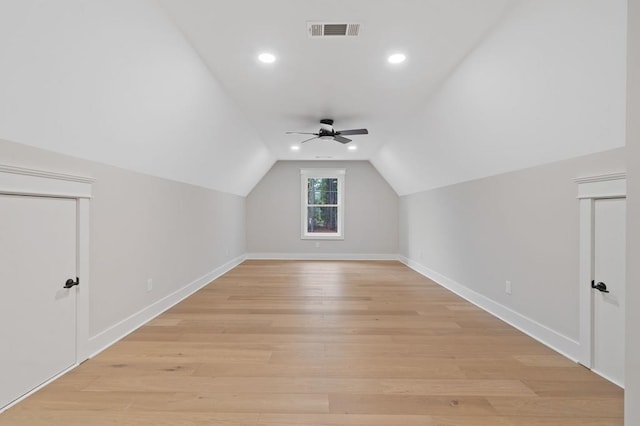 bonus room with light hardwood / wood-style floors, ceiling fan, and lofted ceiling