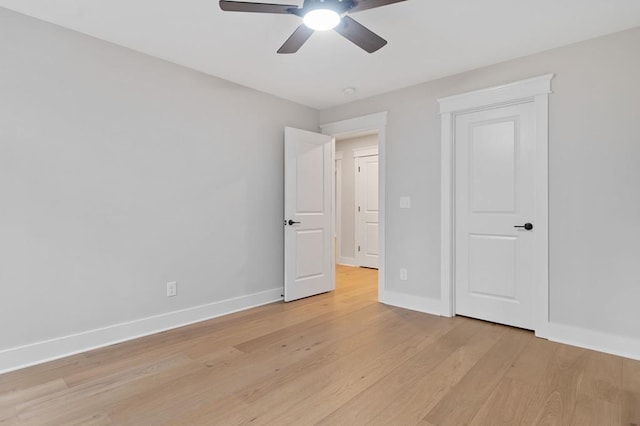 unfurnished bedroom featuring ceiling fan and light hardwood / wood-style floors