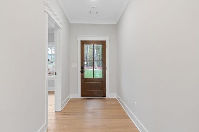 doorway featuring light hardwood / wood-style floors and crown molding